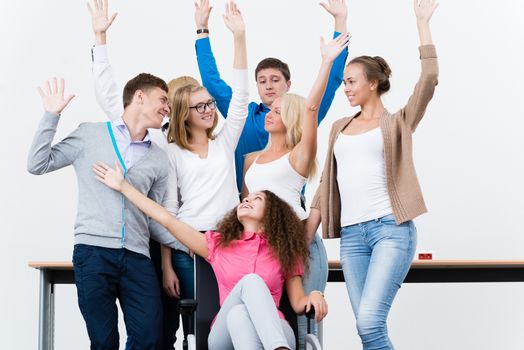 University students in the class raised their hands and having fun