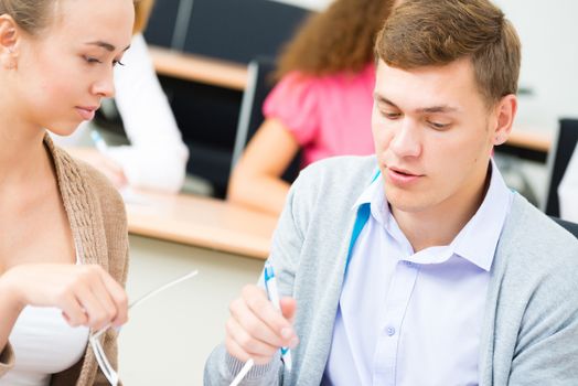 image of a two students in the class talk