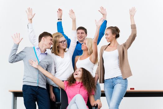 University students in the class raised their hands and having fun