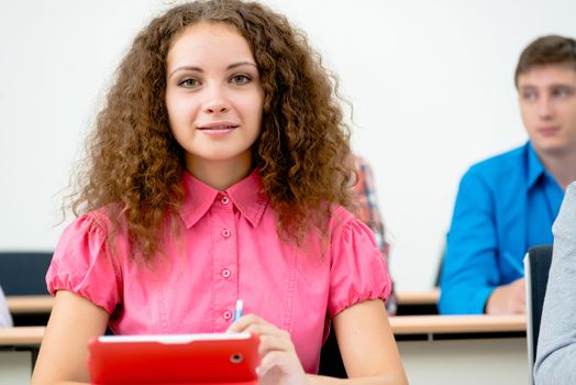 image of a young female student in the classroom, teaching at the University of