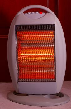 A plastic lit electric heater, entire view