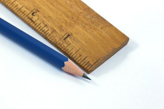 Ruler and pencil isolated on white background