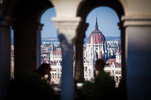 View of Hungarian Parliament Building with customers at Buda Castle restaurant, Budapest, Hungary