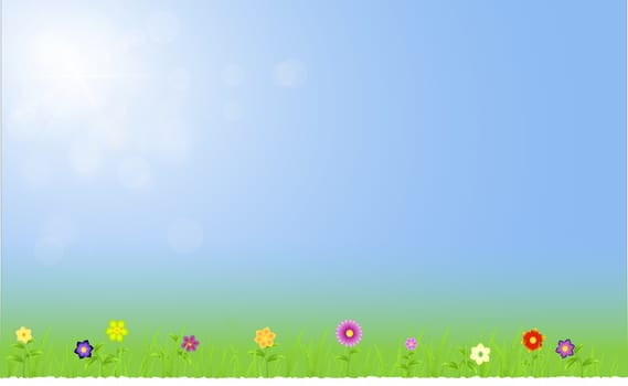 Spring landscape with flowers,grass,raindrops on a blue sunny background sky with ray of lights