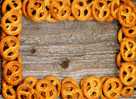 Frame of Tasty Pretzels closeup on Rustic Wooden background