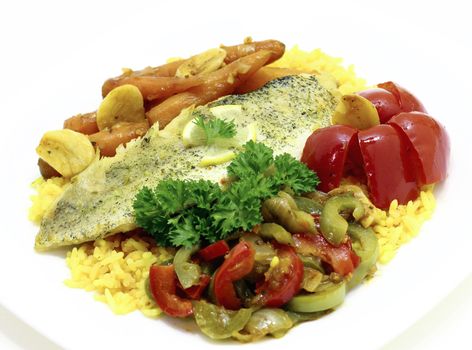 Fried pike fillets served with rice and vegetables 