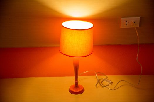 orange lamp on table