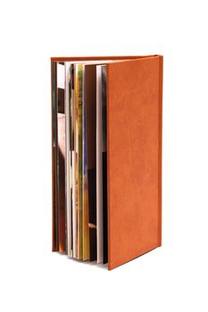 photograph album in a brown cover on a white background