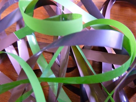 Bright colourful plastic ribbons twisted in an unusual pile