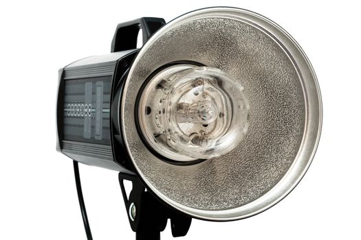 Modern powerful photographic flash on a white background