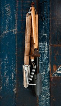 Gardening tools hanging on the wall