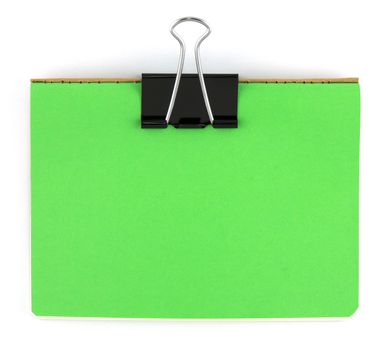 Black clip and green blank note paper