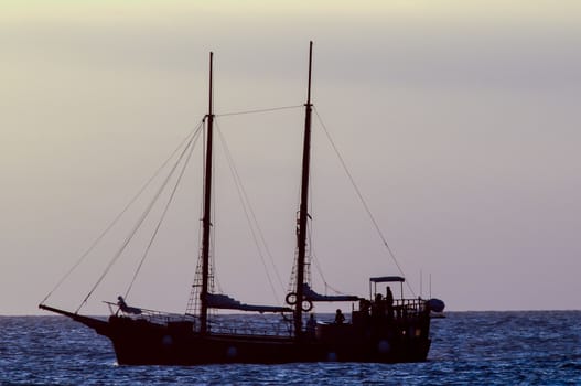Antique Vintage Sail Vessel on the Ocean at Sunset