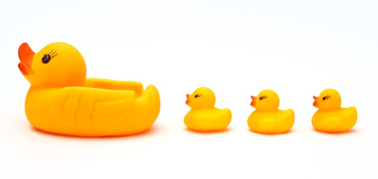 Cute yellow rubber duck isolated over white background