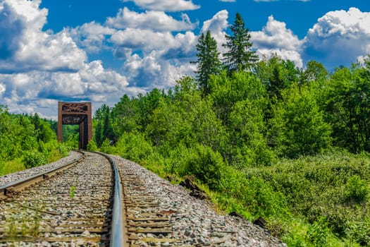 An amazing view of a really long railway on a sunny day. Canada.