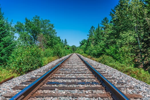 An amazing view of a really long railway on a sunny day. Canada.