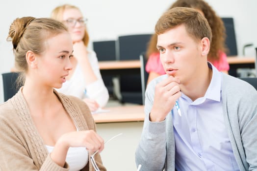 image of a two students in the class talk