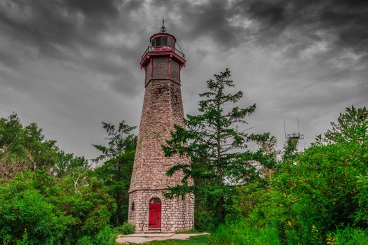 An abandonded lighthouse in cloudy rainy day in the evening on an Island near Toronto City in Canada.