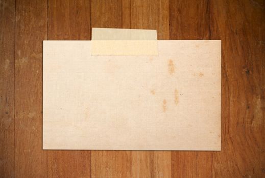 close up of old paper on wood
