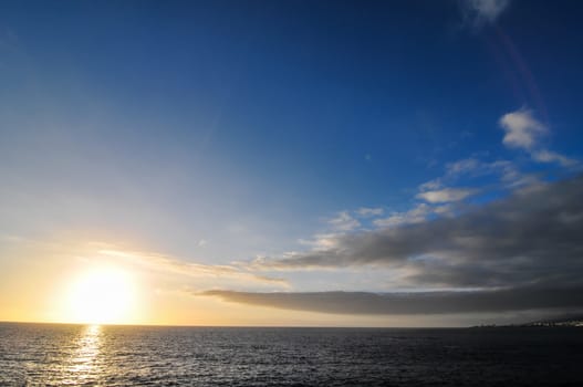 Cloudscape, Colored Clouds at Sunset near the Ocean