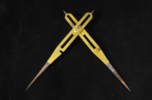 Vintage Angle Measuring Tool on a Black Background