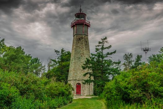 An abandonded lighthouse in cloudy rainy day in the evening on an Island near Toronto City in Canada.