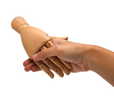 Handshake between a human hand and a wooden hand