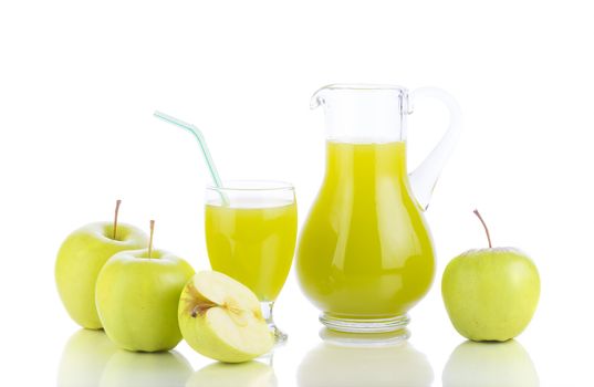 Juicing background. Fresh apples, glass with juice and carafe on white background. Healthy fruit eating and drinking.
