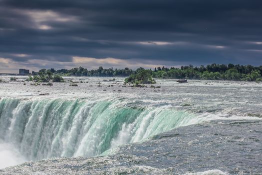 The view of the Niagra falls from the canadian side on a beautiful sunny day in Ontario, Canada.