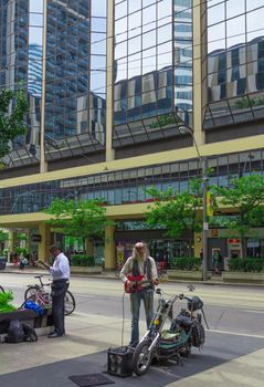 A really good street guitarist playing the guitar in Toronto city, Canada.