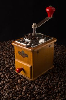 old coffee grinder on a black background