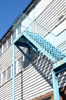 wooden building with fire escape