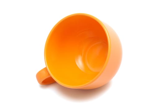 Beautiful orange cup on a white background