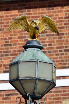 Owl street lght with brick background