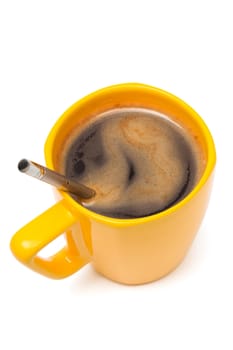 Yellow mug from coffee on a white background