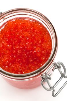 Red caviar in glass can on a white background