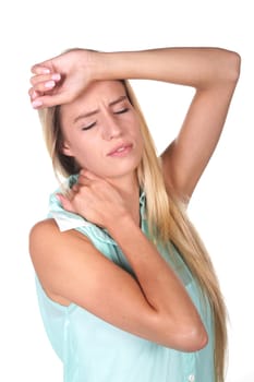 Young lady with migraine headache and sore neck with hand on forehead