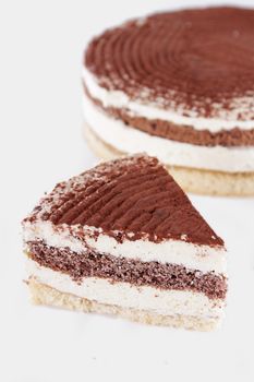 Tiramisu piece of cake isolated on white