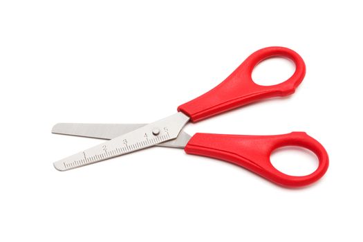 red scissors with a ruler on a white background