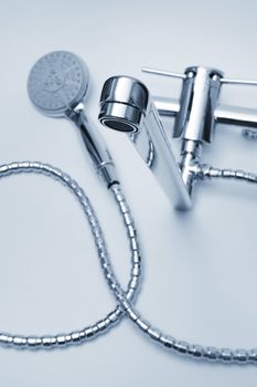 modern metal faucet and shower close up