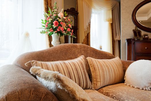 Beautiful sofa at a window in a modern apartment