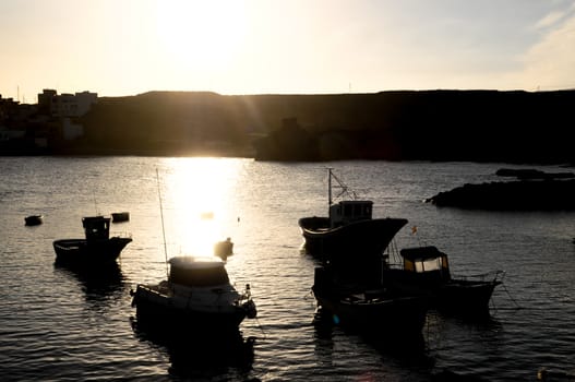 Backlight Silhouette Boats at Sunset in the Atlantic Ocean