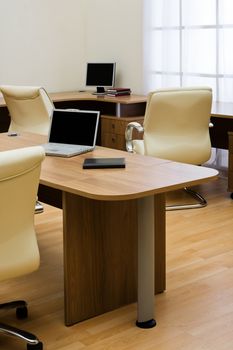 Beige leather armchairs at modern new office