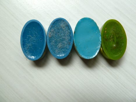 Moulded colourful plastic oval shapes showing the backs