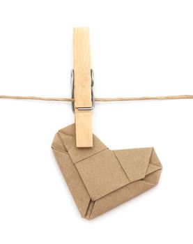 Origami recycle Paper heart and clothespins attached to a rope