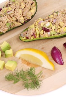 Avocado salad and tuna. Isolated on a white background.