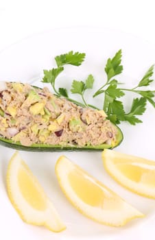 Avocado salad with tuna. Isolated on a white background.