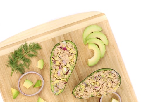 Avocado salad with tuna. Isolated on a white background.