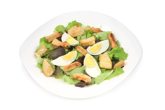 caesar salad with eggs. Isolated on a white background.