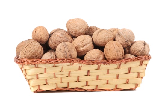 Basket of walnuts. Isolated on a white background.